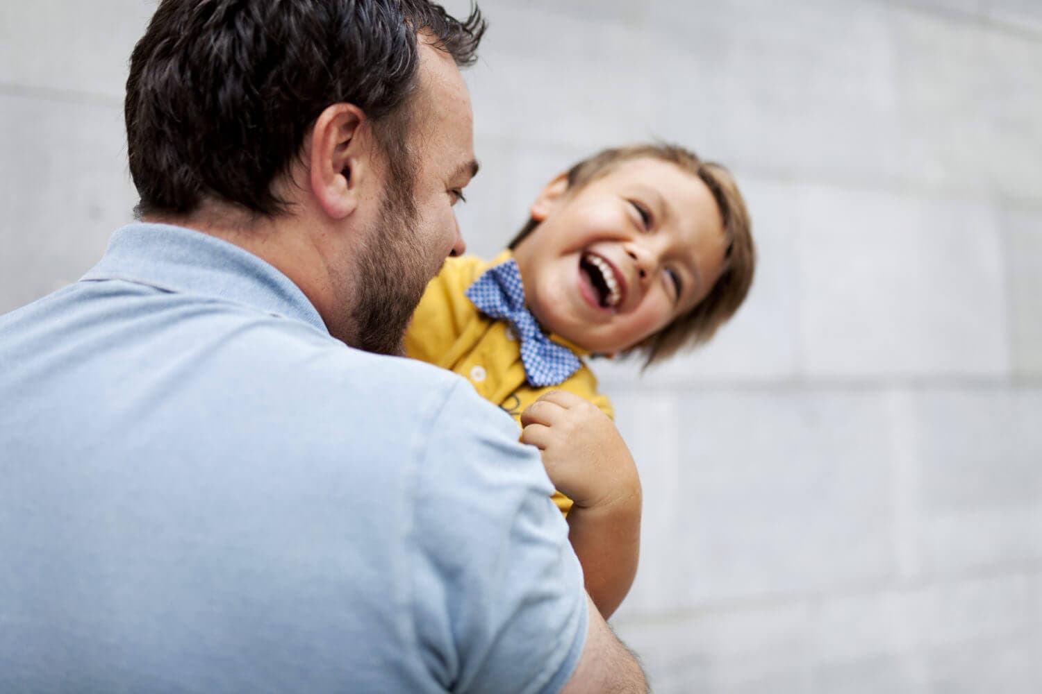 dad and son smiling