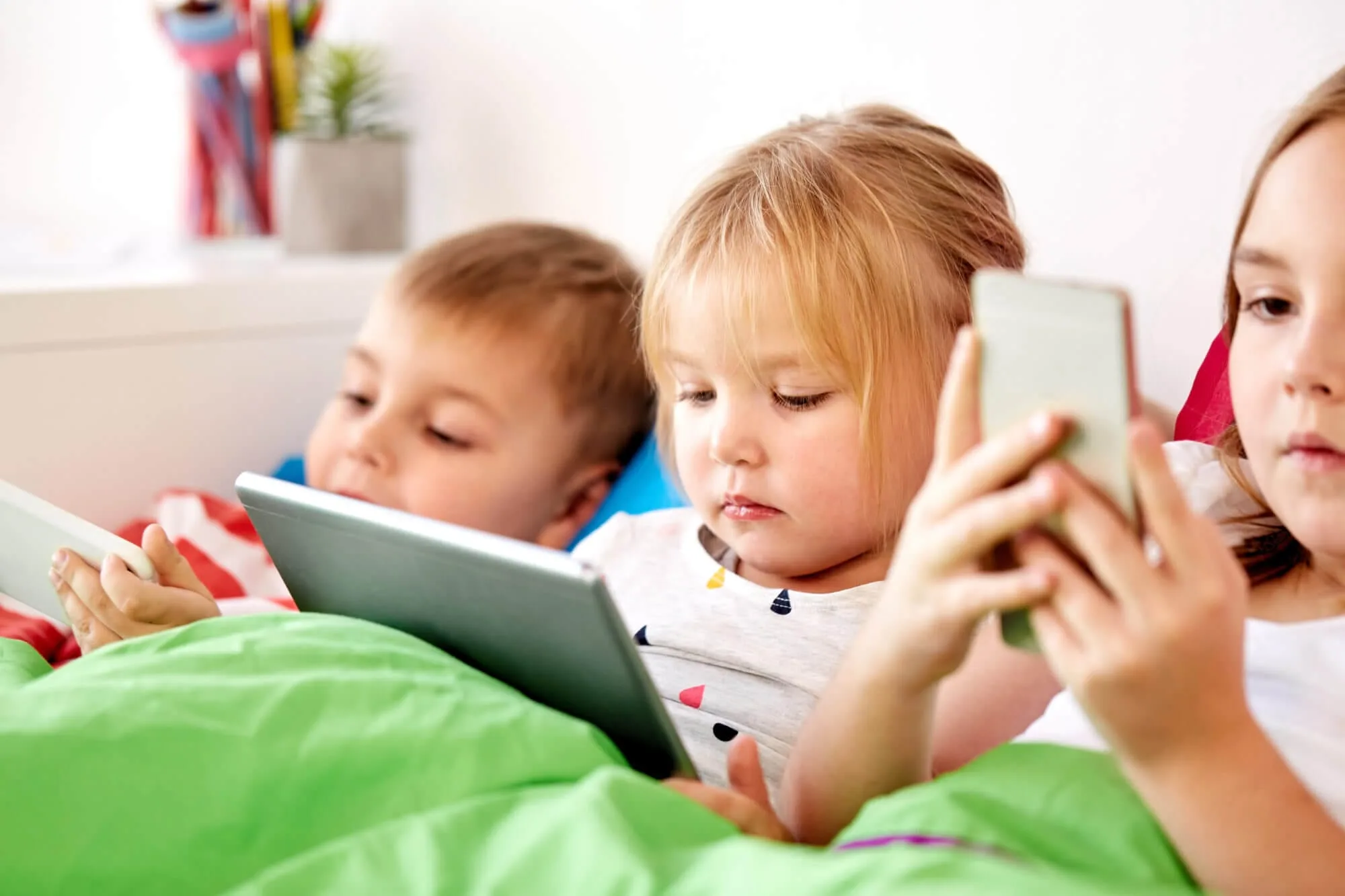 kids watching their phones and tablets