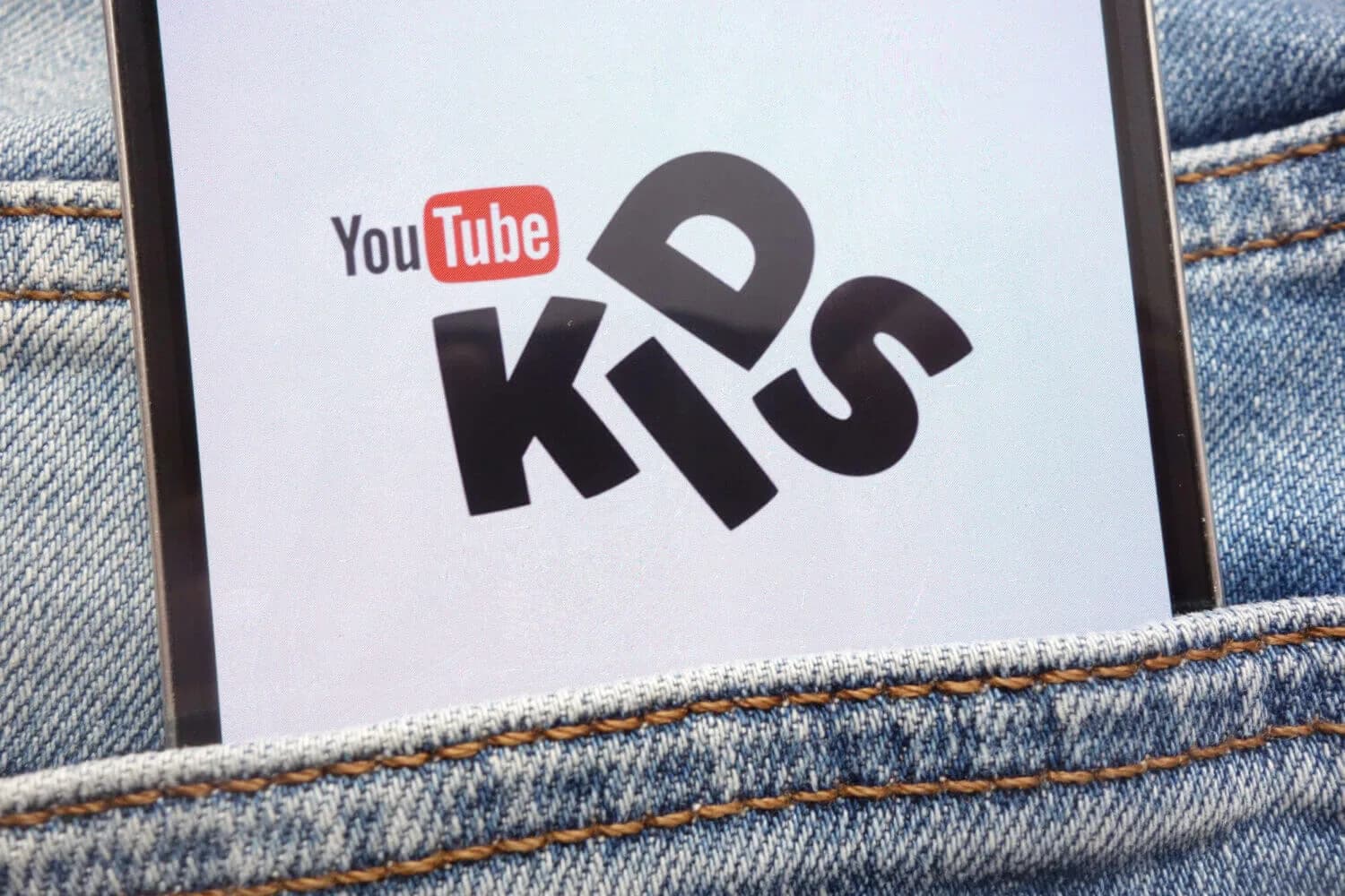 youtube kids on a phone in a pocket