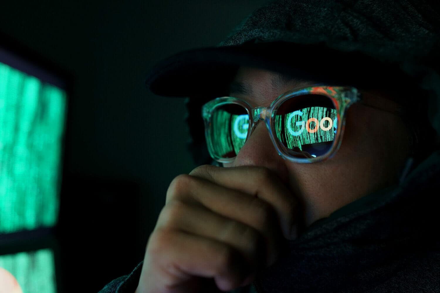 man looking at google on a computer with sunglasses