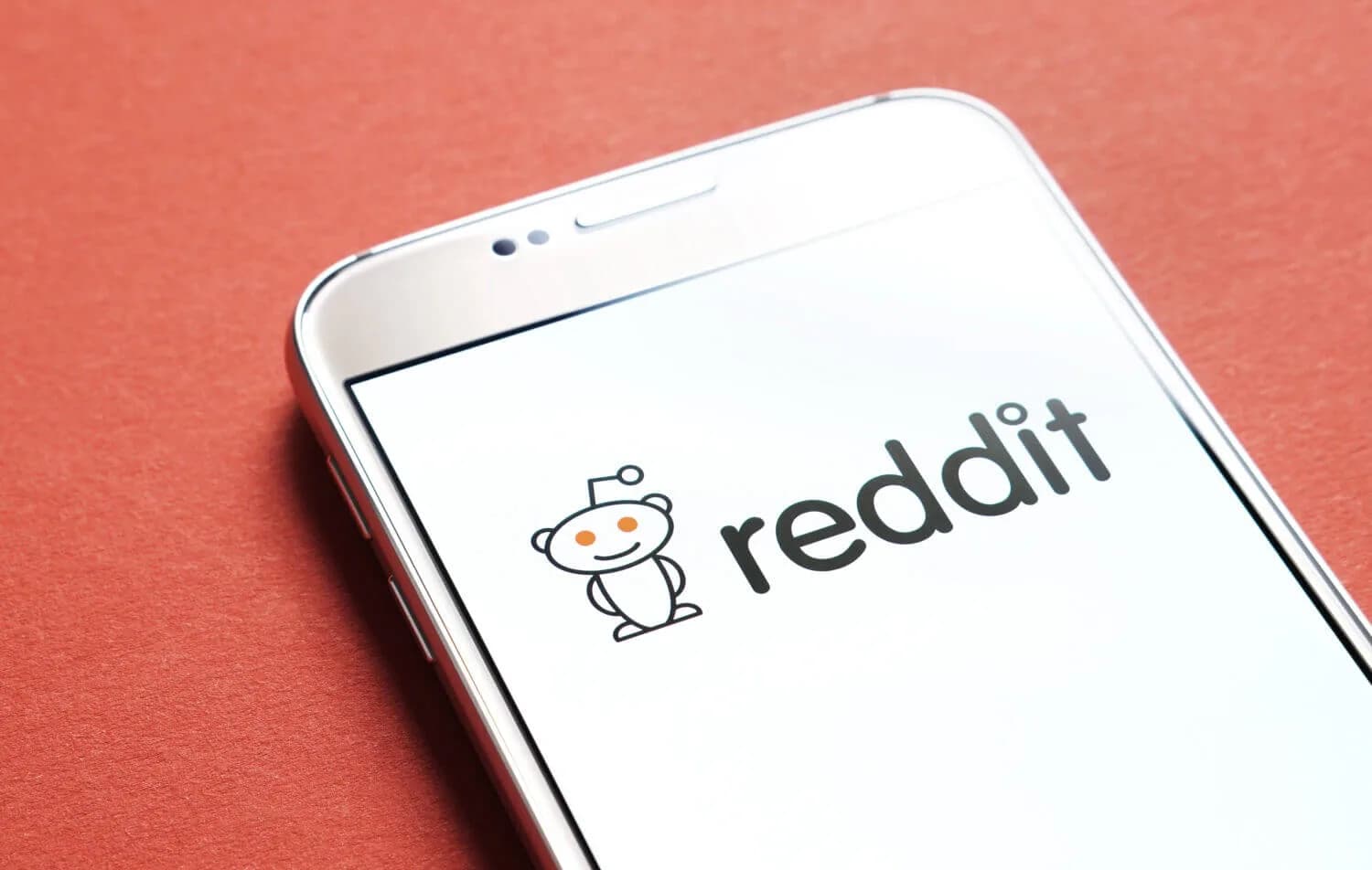 Reddit logo on a phone